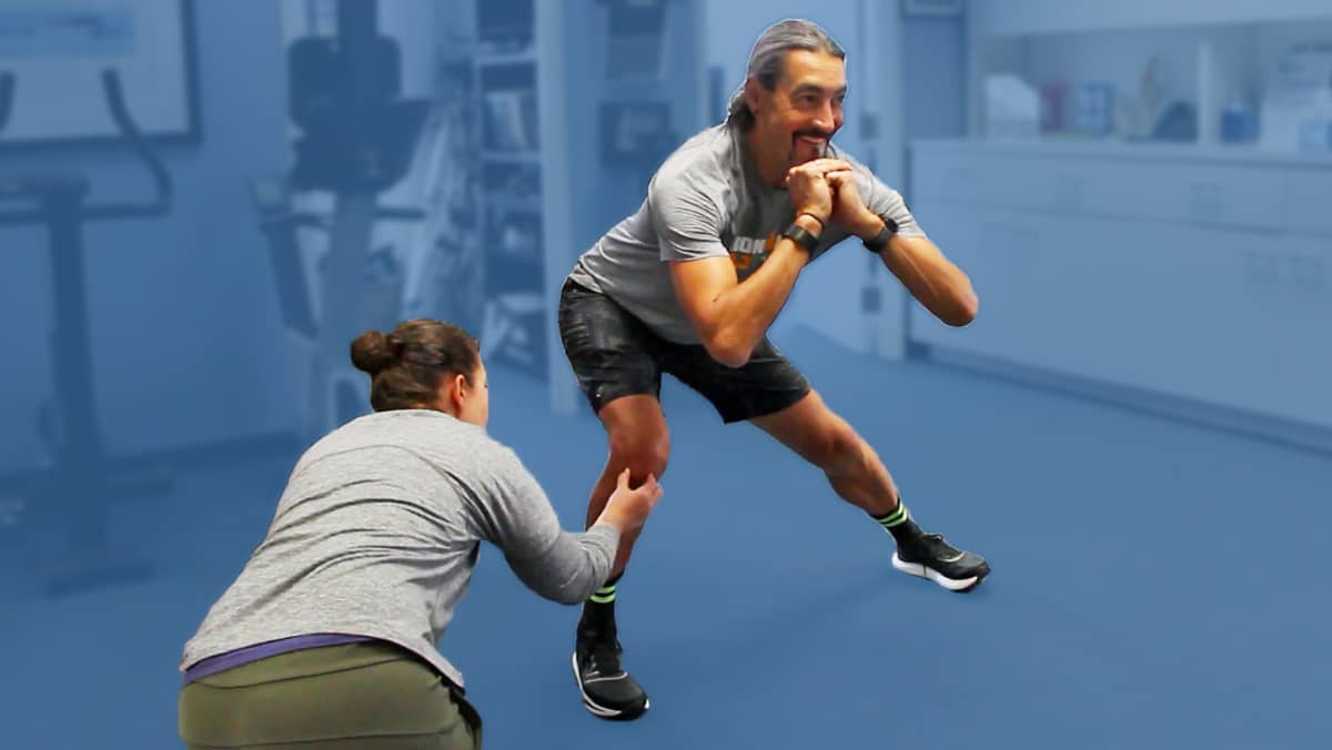 Athletic Trainer Coaching Rehab Patient at Physical Therapy Clinic San Francisco