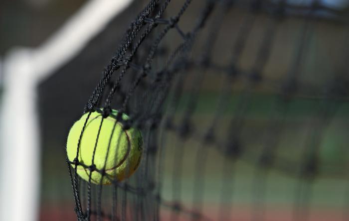 Unforced error - tennis ball hits the net 